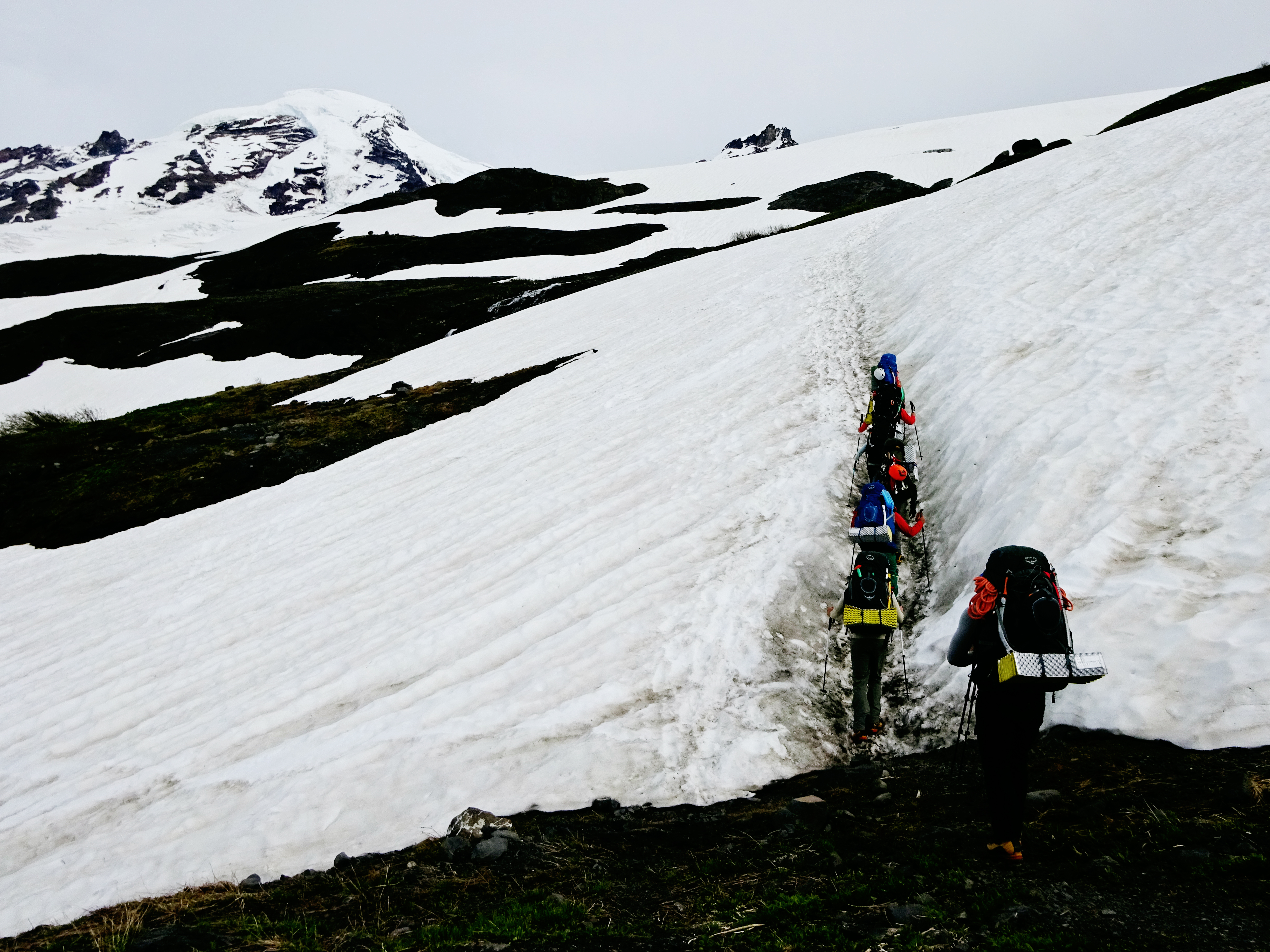 Stepping onto the first snowfield while hiking up to base camp on Mt Baker